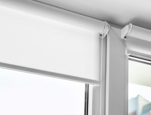 Close-up view of white window blinds.